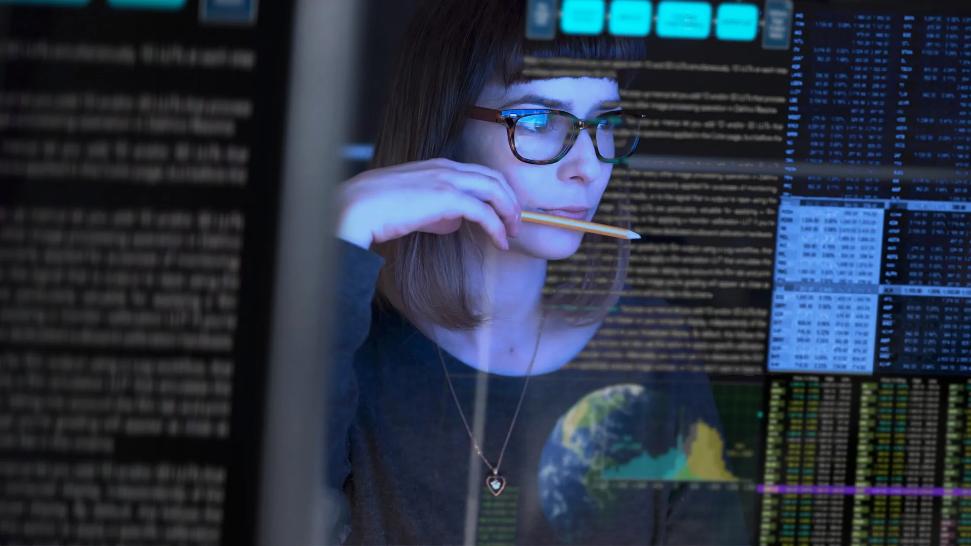 a woman looking at a screen a woman looking at a screen