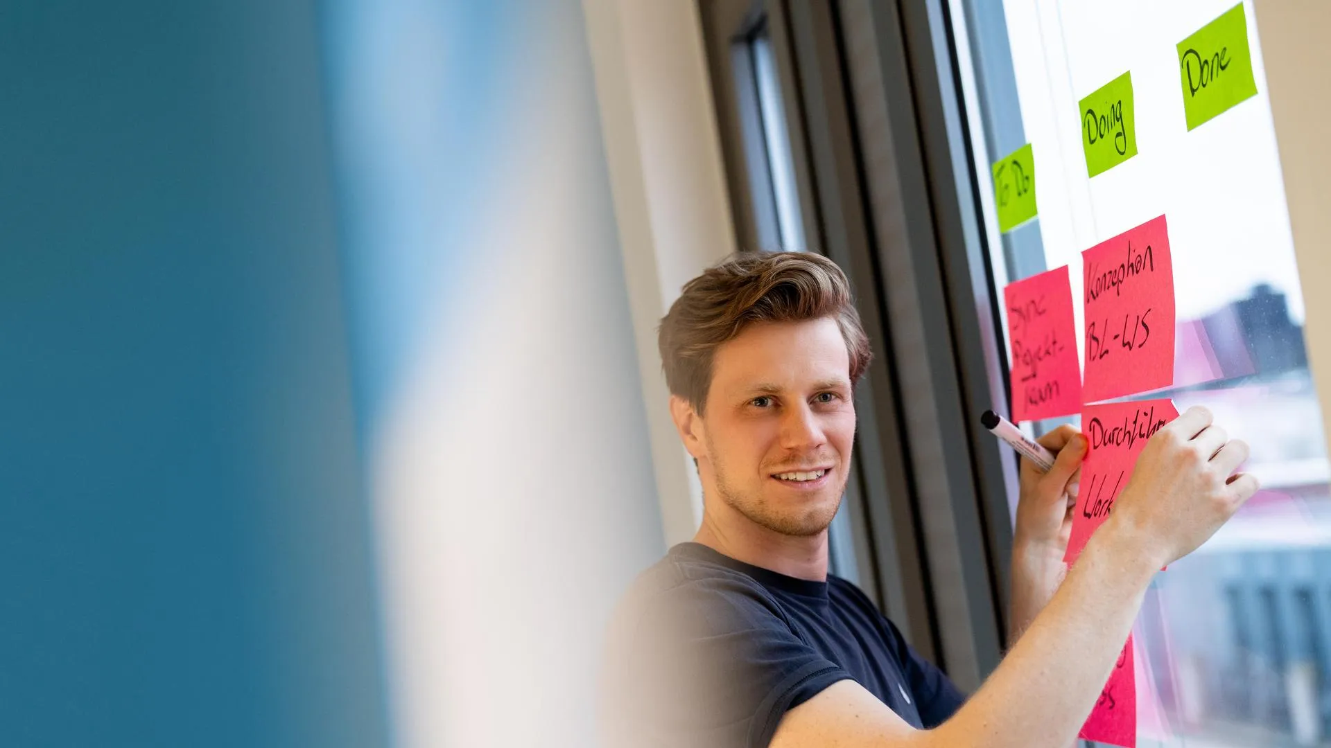 a man writing on a whiteboard a man writing on a whiteboard