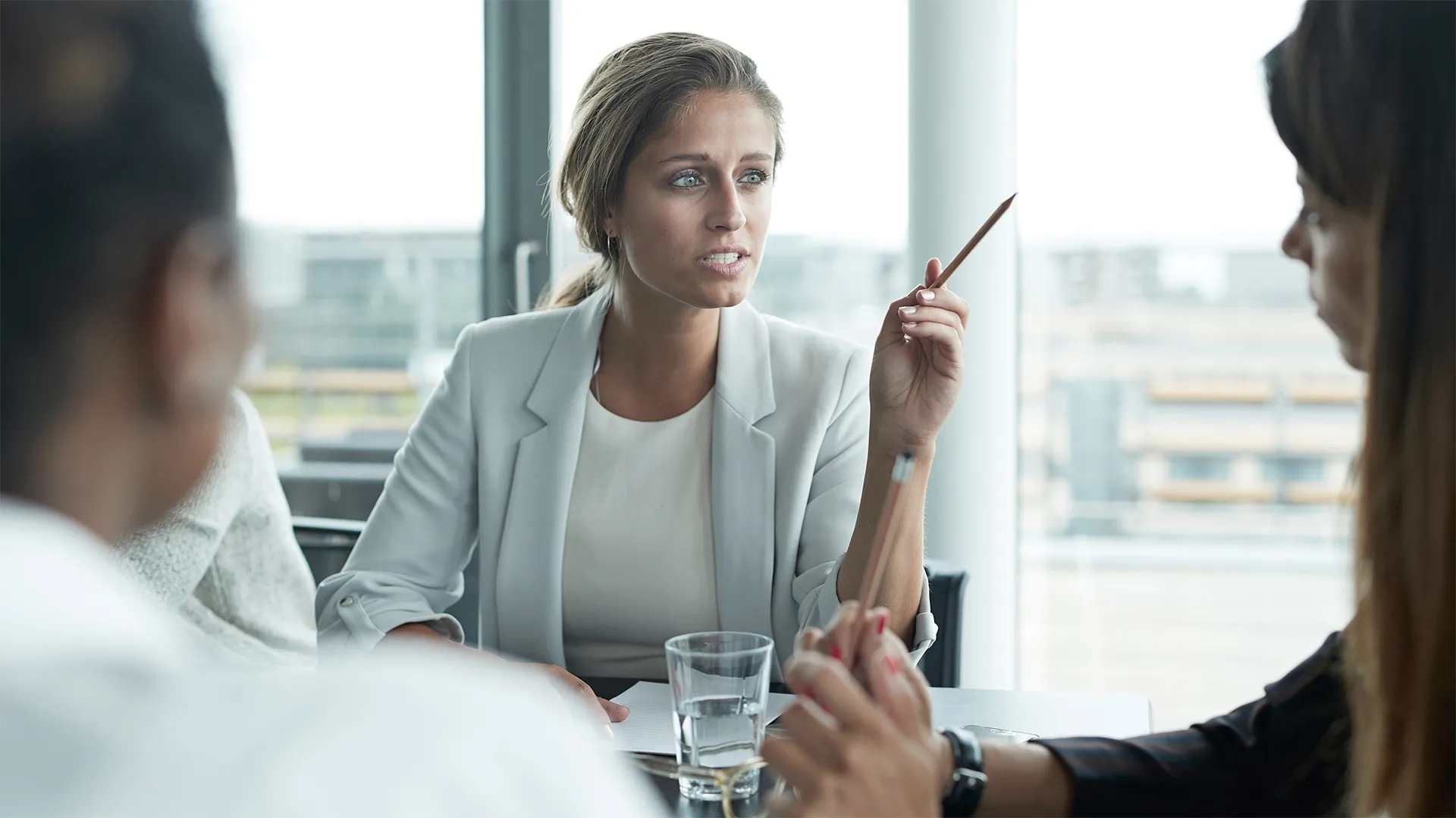 a woman holding a pencil