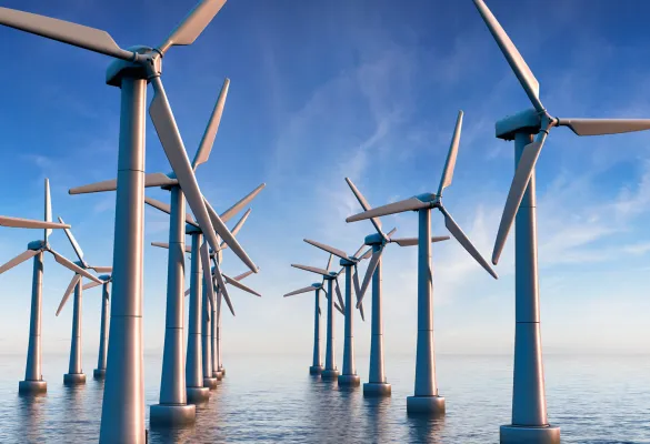 a group of windmills in the water