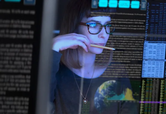 a woman looking at a screen