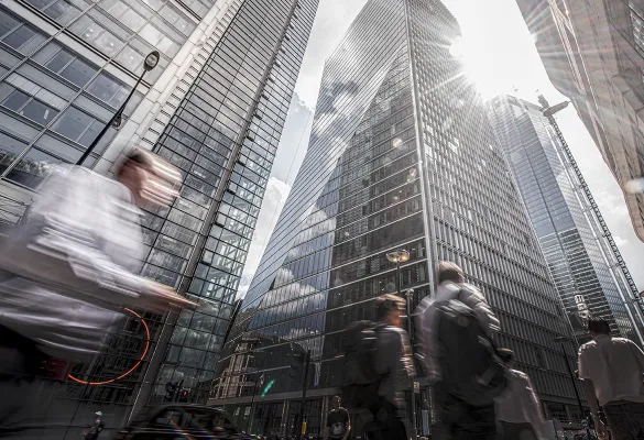 a group of people walking in a city