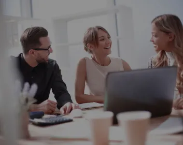 a group of people sitting around a table