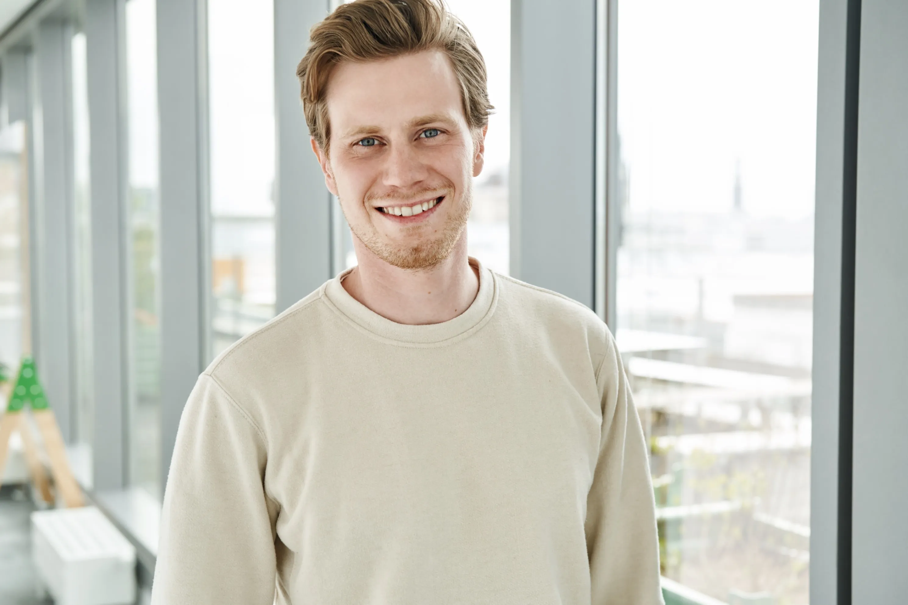 a man smiling at camera